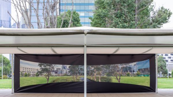 A photograph of nature printed on wall of mpavilion